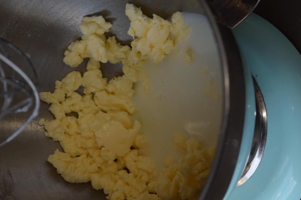 Homemade butter - the whipping cream begins to separate into buttermilk and butter
